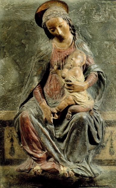 Terracotta Virgin and Child. Mary is seated,...