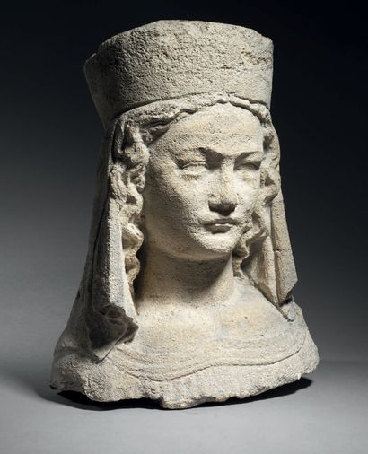 Carved bust of a Virgin Mary in fossiliferous...