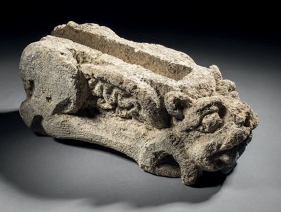 Gargoyle in sandstone carved in a pinkish...