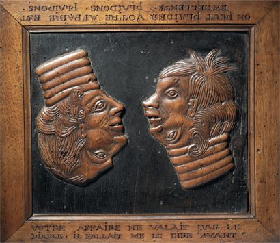 Panneau satirique en noyer sculpté en bas-relief...