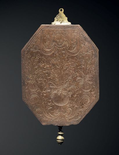 Octagonal mirror adorned on one side with...