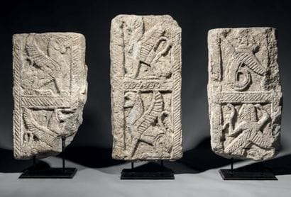 Three fragments of friezes in grey tuff,...