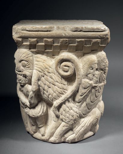Carved limestone capital historiated on all...