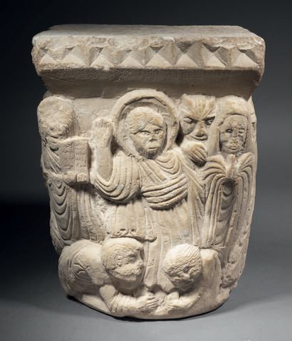 Carved limestone capital historiated on all...