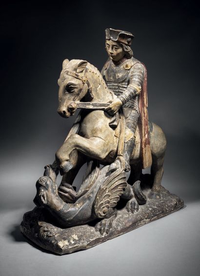 Saint George slaying the dragon in limestone...