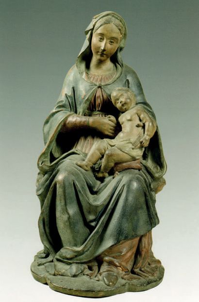 Terracotta Virgin and Child. Mary is seated,...