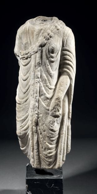 Statue of an acephalous woman in marble carved...