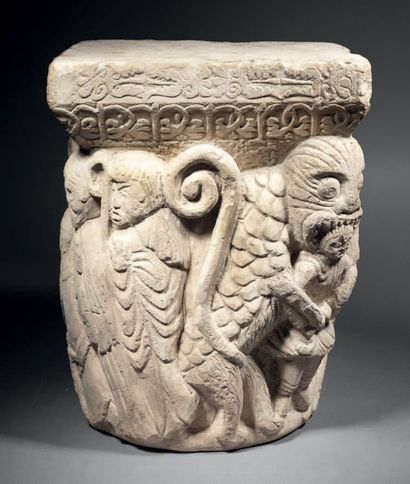 Carved limestone capital historiated on all...