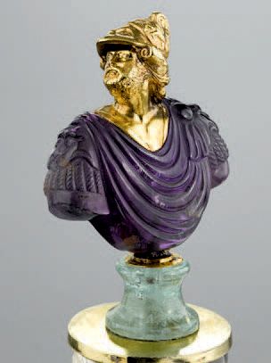 Large amber bust carved in the round representing...