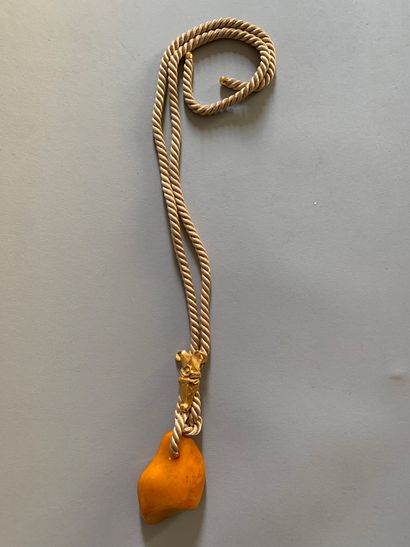 Pendant necklace in pressed amber, the beige...
