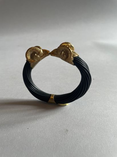 Openwork bangle decorated with chased caprid...