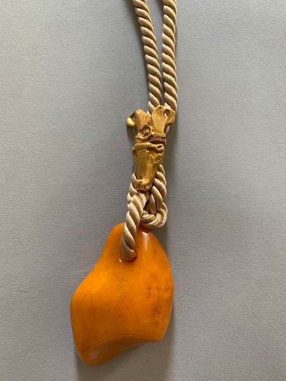 Pendant necklace in pressed amber, the beige...