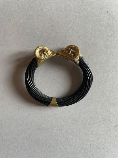 Openwork bangle decorated with chased caprid...