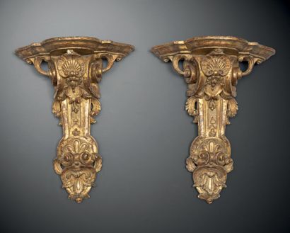 Pair of wall brackets in molded, carved and...