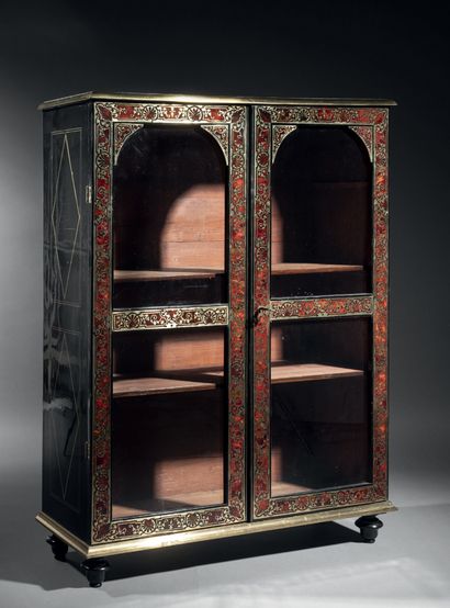 High cabinet in blackened wood, brass fillets...