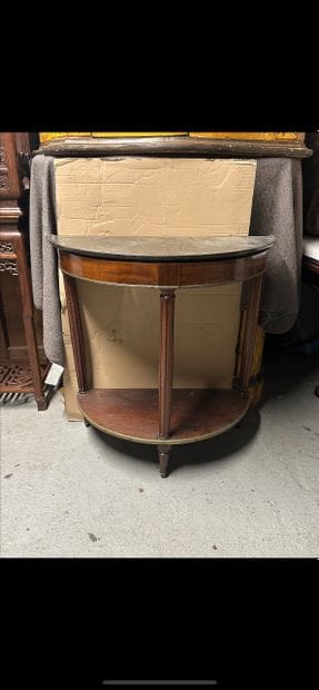 Mahogany and mahogany veneer half-moon console....