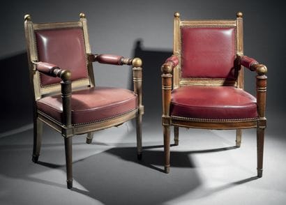 Pair of armchairs in molded wood, gilded....