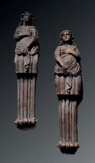 Pair of carved oak terms representing two...