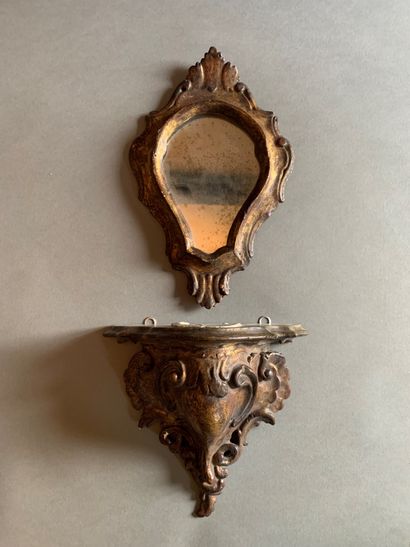 Suite of three carved and gilded wood consoles...