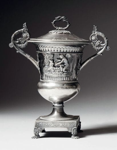 Covered sugar bowl on pedestal resting on...