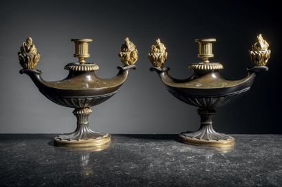 Pair of candlesticks in brown patina and...
