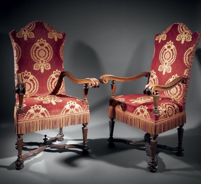 Pair of large molded and carved walnut armchairs....