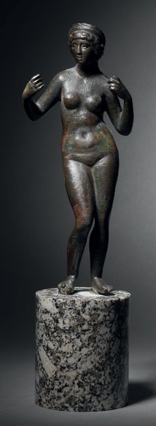 Statuette of an impudent Venus with her arms...