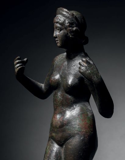 Statuette of an impudent Venus with her arms...