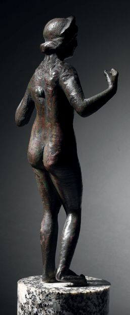 Statuette of an impudent Venus with her arms...