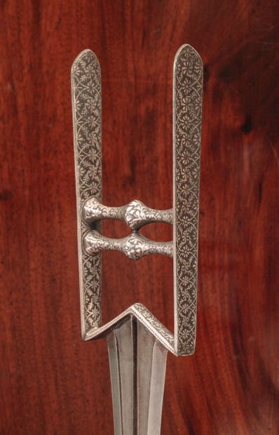 Katar with silver damascened floral design
Partially...
