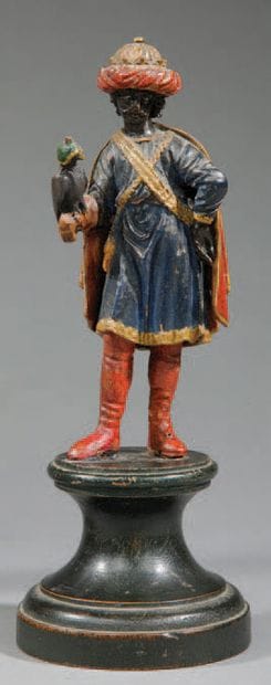 Turbaned falconer with blindfolded bird of...