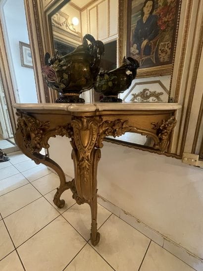 Carved and gilded wood sconce console. Two...