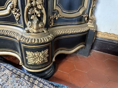 A blackened wood, brass fillet and very rich...