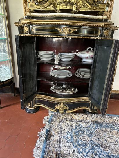 A blackened wood, brass fillet and very rich...