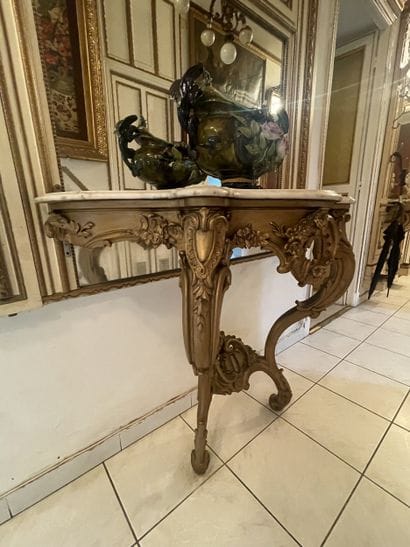 Carved and gilded wood sconce console. Two...