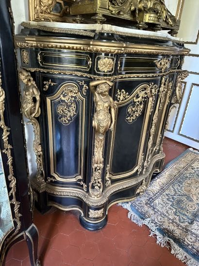 A blackened wood, brass fillet and very rich...