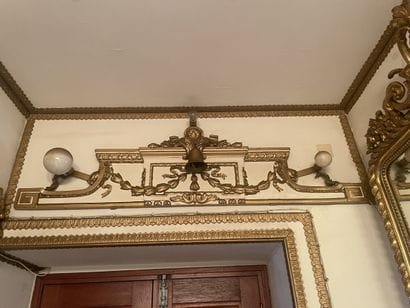 Pair of pediments in carved wood, cream lacquered...