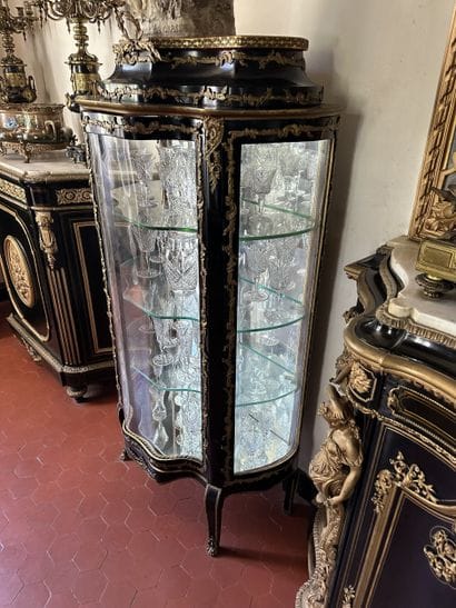 Curved display case in blackened wood with...