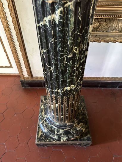Column in wood painted to imitate sea-green...