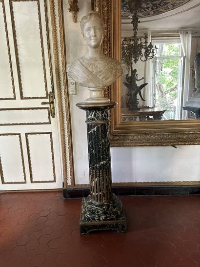 Column in wood painted to imitate sea-green...