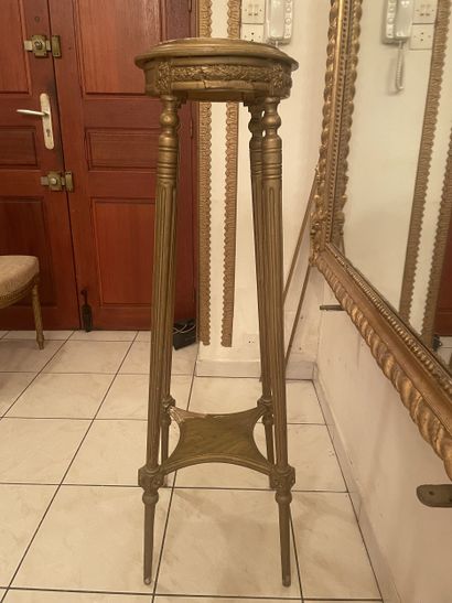 Four-legged pedestal in carved gilded wood....