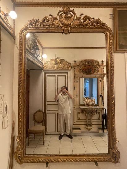 Mirror in stuccoed and gilded wood. Frame...