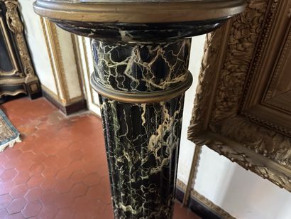 Column in wood painted to imitate sea-green...