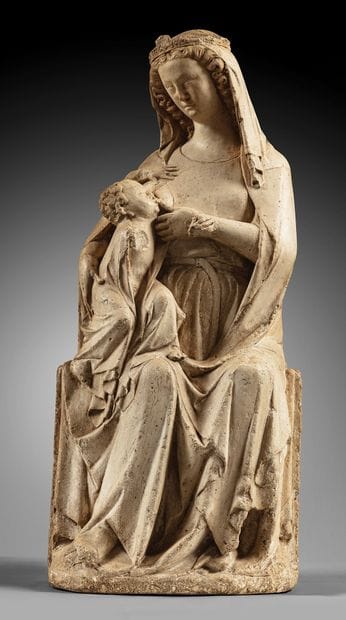 Carved limestone Virgin and Child nursing....