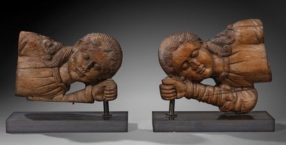 Pair of reclining angel busts in wood carved...