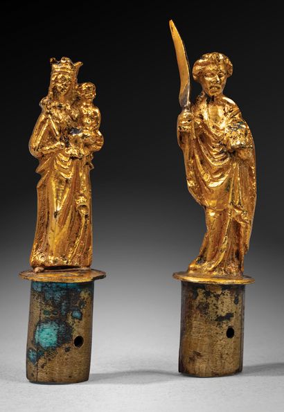 Two silver and gilt statuettes in the round...