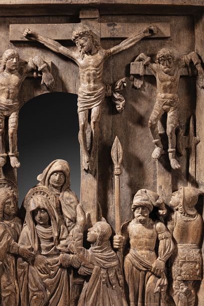 Walnut triptych carved in bas-relief, depicting...