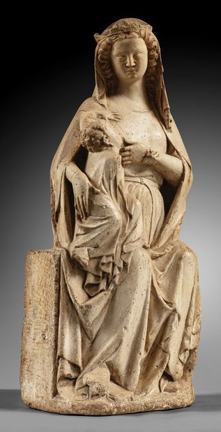 Carved limestone Virgin and Child nursing....