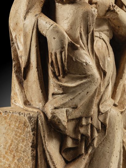Carved limestone Virgin and Child nursing....