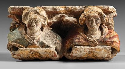 Carved and polychromed limestone corbel decorated...